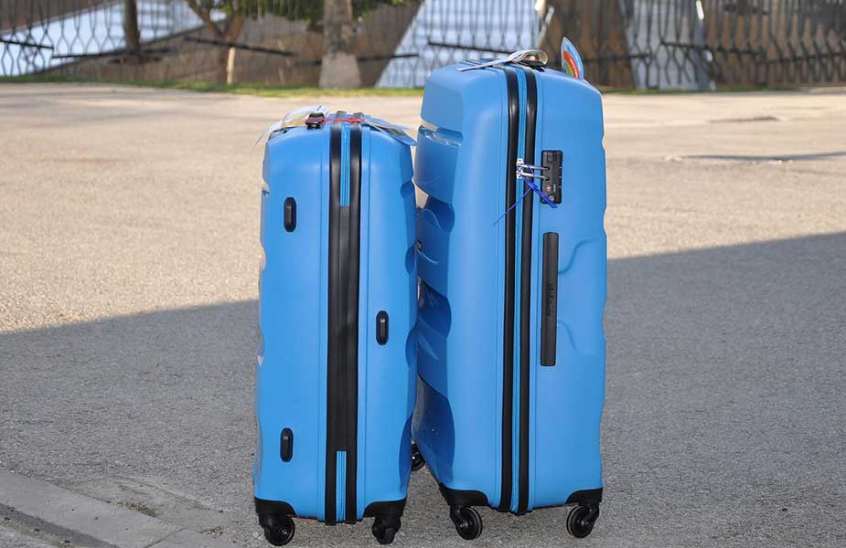 Een blauwe kofferset